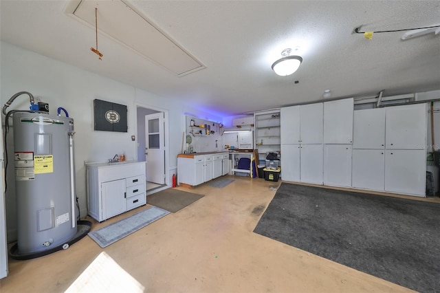 garage featuring water heater and sink