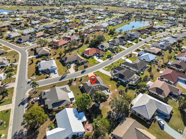 bird's eye view with a water view