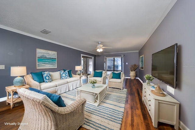 living room with dark hardwood / wood-style floors, ceiling fan, and ornamental molding