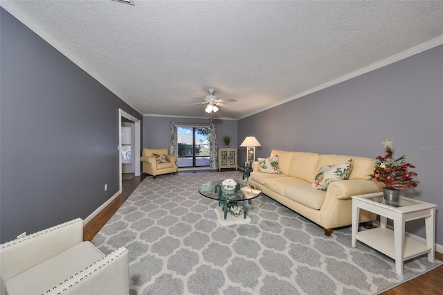 living room featuring ceiling fan, a textured ceiling, and hardwood / wood-style flooring