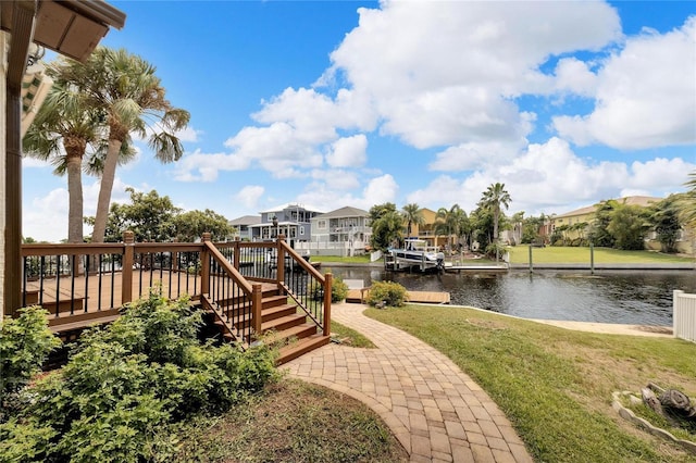 view of yard featuring a deck with water view