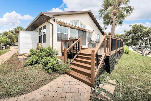 rear view of house with a deck