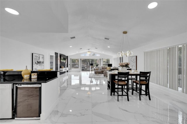 dining space with vaulted ceiling