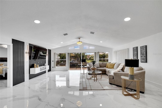 living room featuring lofted ceiling and a textured ceiling