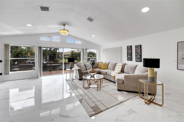 living room with lofted ceiling, a wealth of natural light, and a textured ceiling