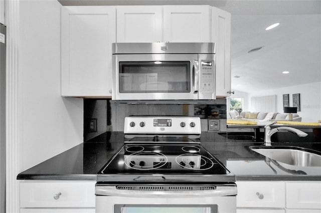 kitchen featuring white cabinetry, appliances with stainless steel finishes, and sink