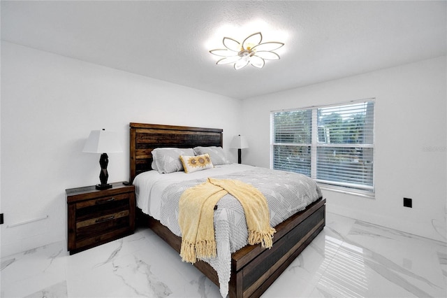 bedroom featuring a textured ceiling