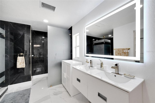 bathroom featuring vanity and tiled shower