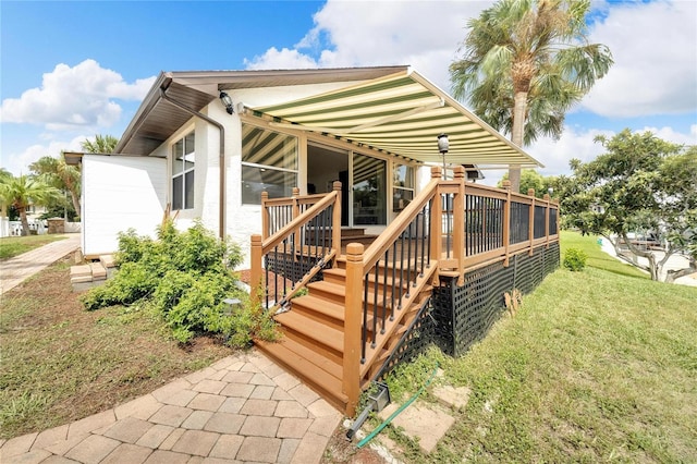 rear view of house with a yard