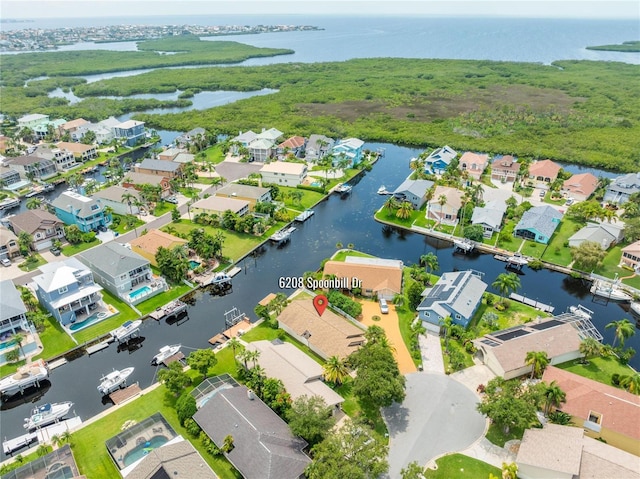 bird's eye view with a water view