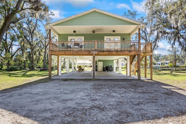 view of front facade with a front yard and a carport