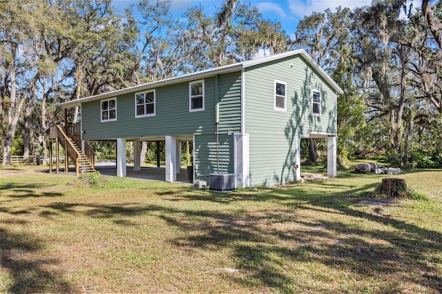 rear view of property featuring a yard