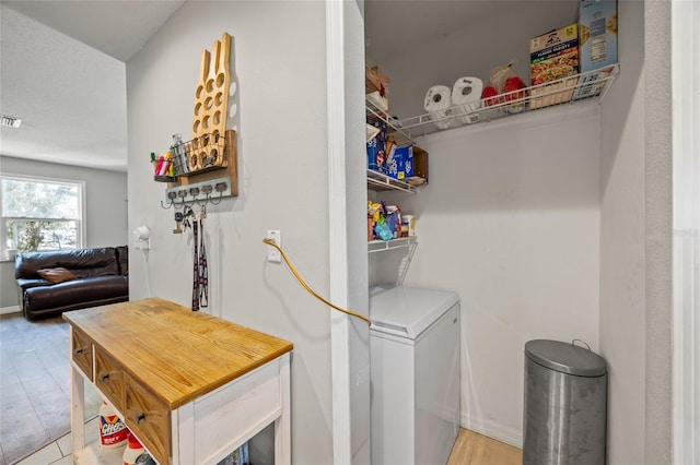 laundry room featuring hardwood / wood-style flooring