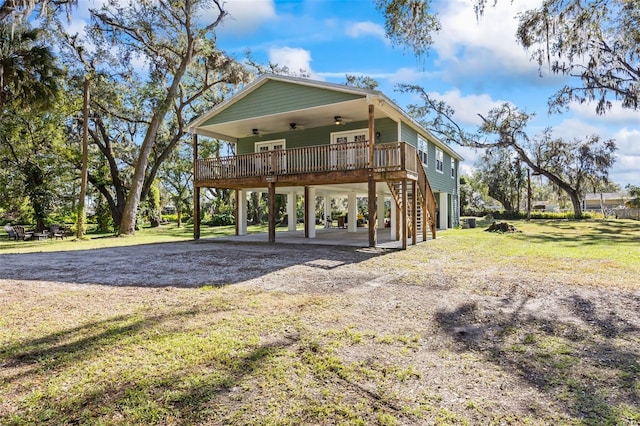 view of front facade with a carport and a front yard