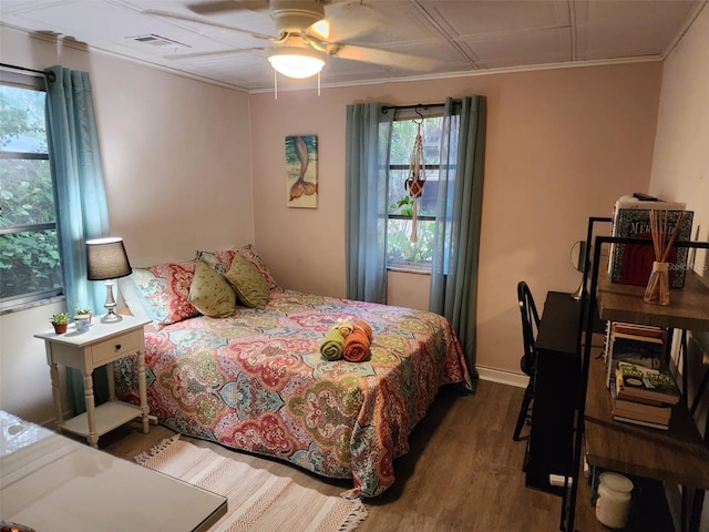 bedroom with hardwood / wood-style floors and ceiling fan