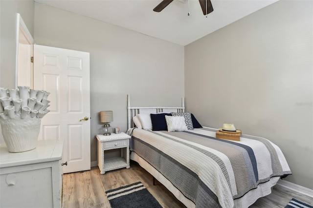 bedroom featuring ceiling fan and light hardwood / wood-style floors