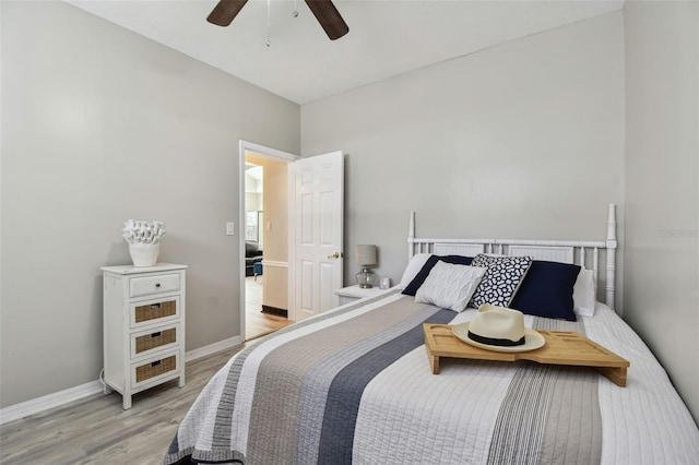 bedroom with ceiling fan and light hardwood / wood-style floors