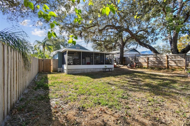 view of yard with a sunroom