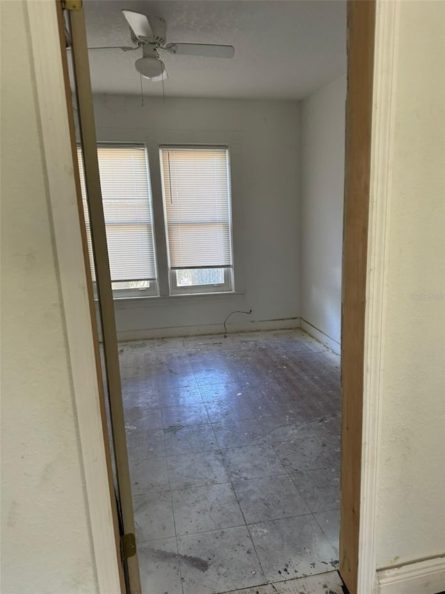 empty room featuring ceiling fan