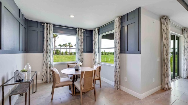 dining area with light tile patterned flooring