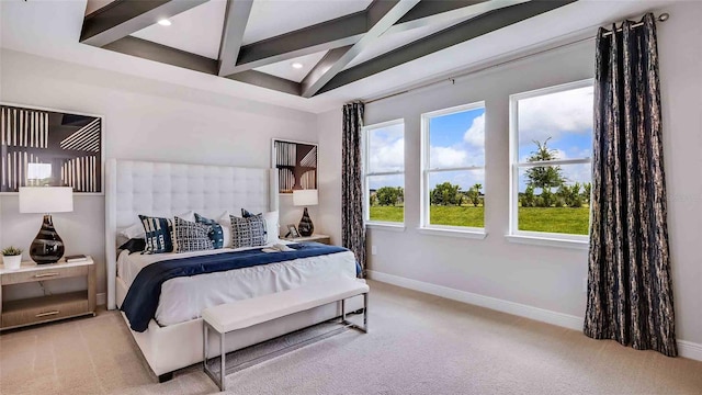 carpeted bedroom with beamed ceiling and coffered ceiling