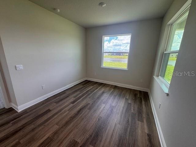 4314 Pullet Ct, Lakewood Ranch, FL 34211 - unfurnished room featuring dark wood finished floors and baseboards