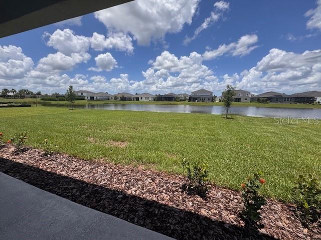 4314 Pullet Ct, Lakewood Ranch, FL 34211 - view of grassy yard with a water view and a residential view