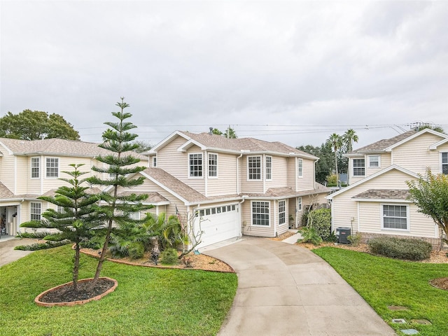 view of front property with a front yard, a garage, and central air condition unit