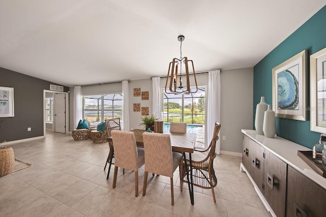 dining space with light tile patterned flooring, vaulted ceiling, and a notable chandelier