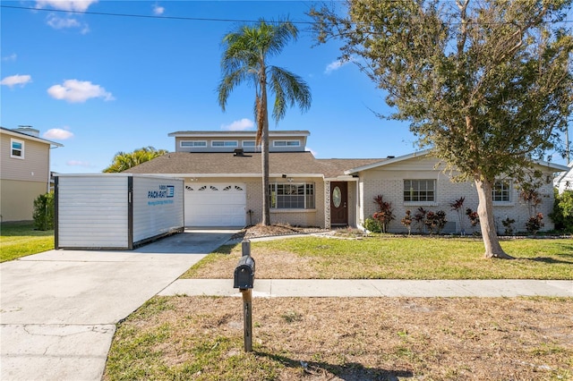 view of front of house with a front yard and a garage