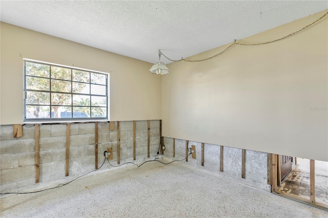 basement with a textured ceiling