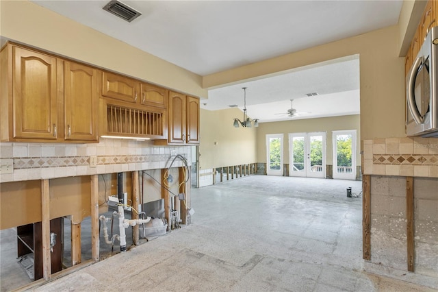 kitchen with pendant lighting, ceiling fan, and french doors