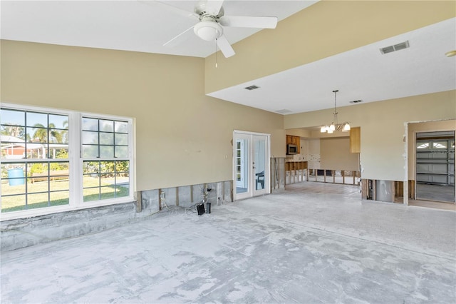 interior space with ceiling fan and french doors