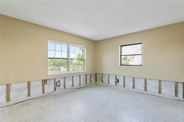 empty room featuring a textured ceiling