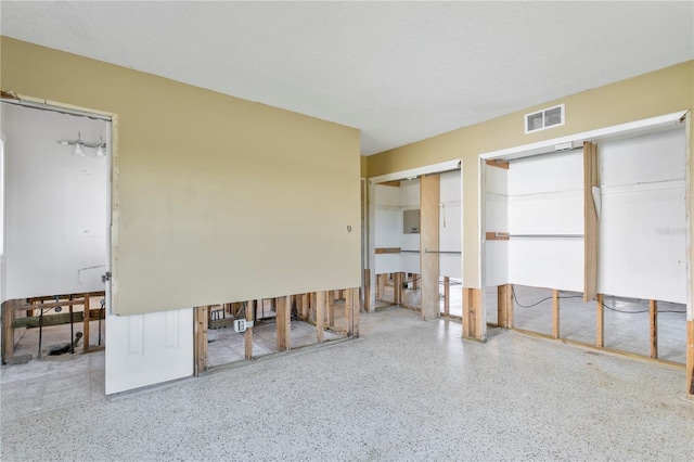 unfurnished bedroom with a textured ceiling