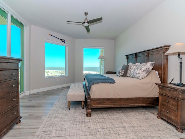 bedroom with light hardwood / wood-style flooring and ceiling fan