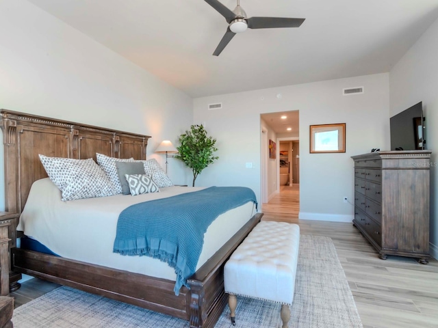 bedroom with ceiling fan and light hardwood / wood-style flooring