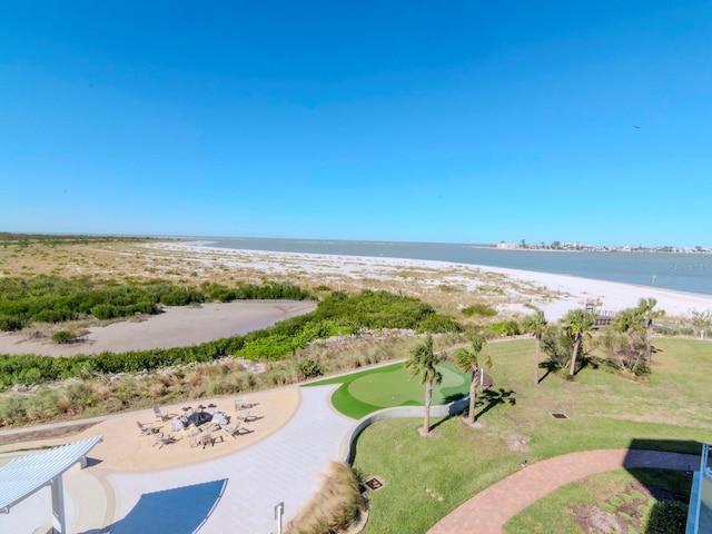 surrounding community with a water view and a beach view