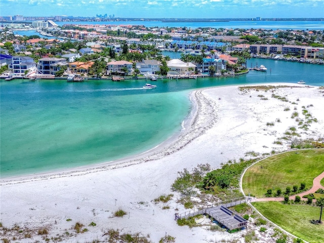 bird's eye view featuring a view of the beach and a water view