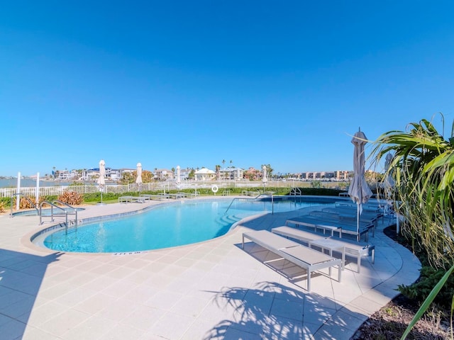 view of swimming pool featuring a patio area