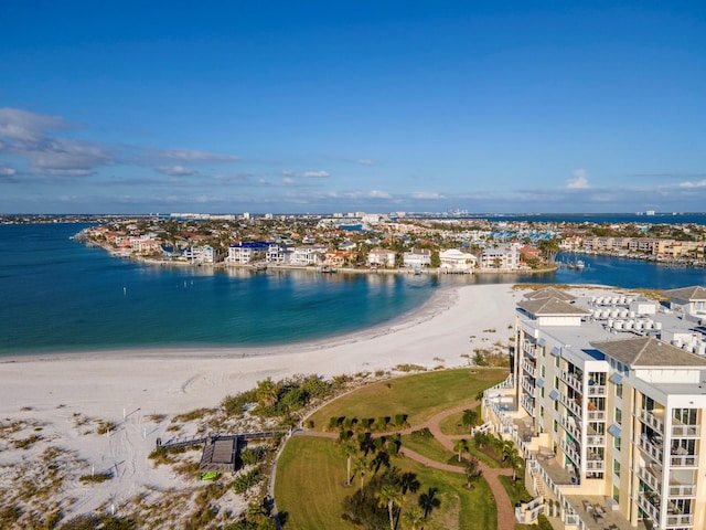 birds eye view of property with a water view and a view of the beach