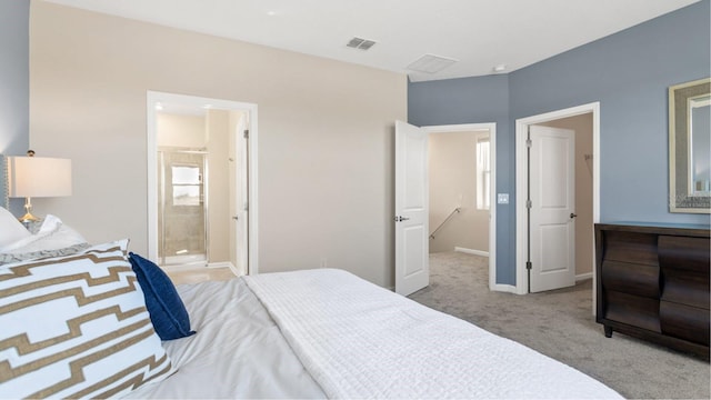 bedroom featuring light carpet and connected bathroom