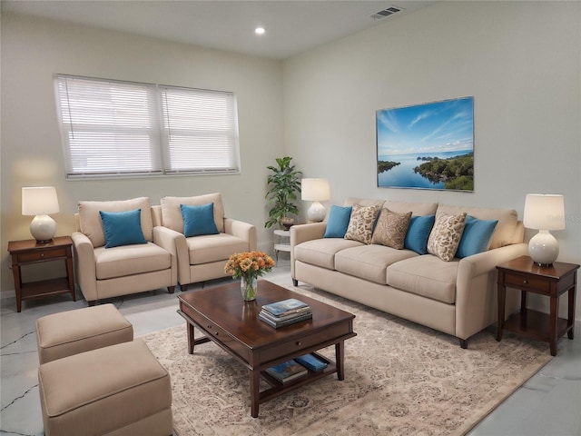 living room featuring visible vents and recessed lighting