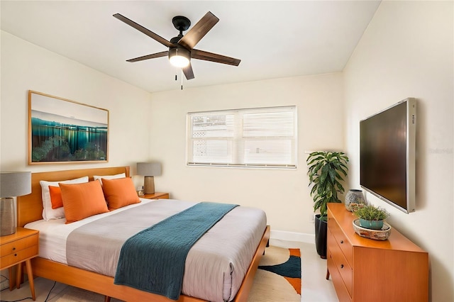 bedroom featuring ceiling fan and baseboards