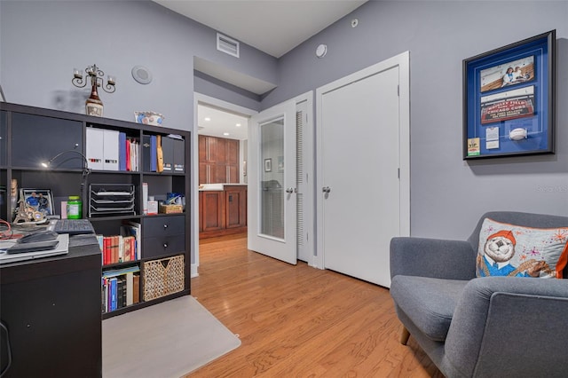 office with light wood-type flooring