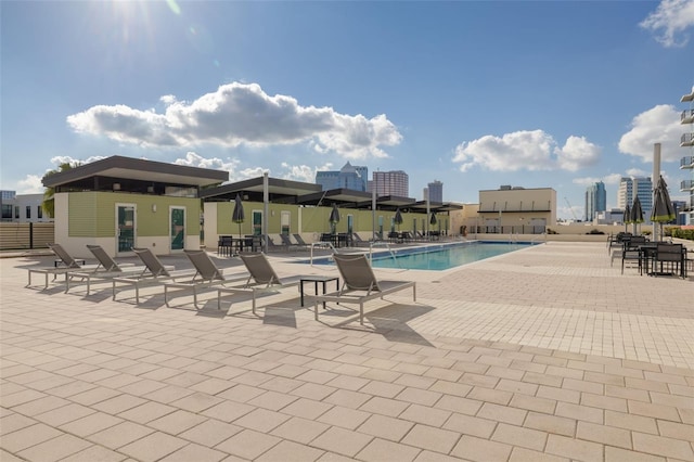 view of swimming pool featuring a patio area