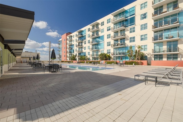 view of swimming pool featuring a patio area