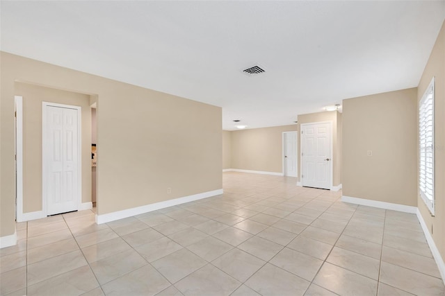 spare room with light tile patterned floors