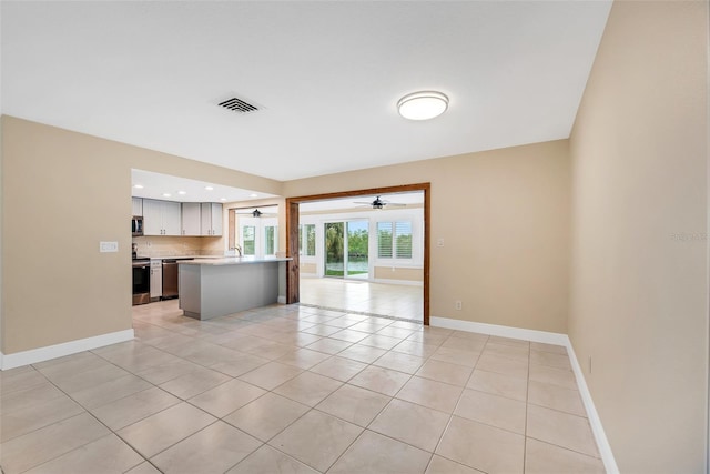 kitchen with light tile patterned floors and appliances with stainless steel finishes