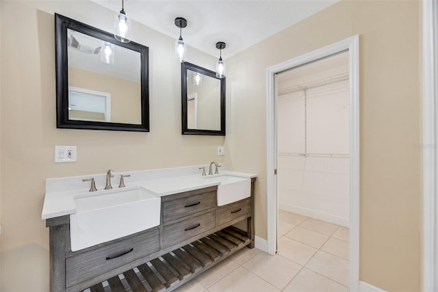 bathroom with tile patterned flooring and vanity